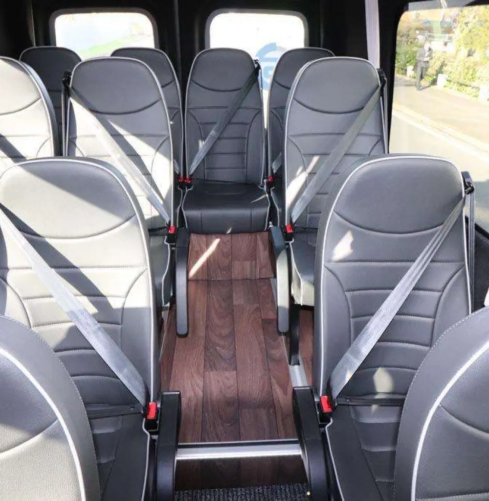 Premium luxury minibus interior with comfortable passenger seating